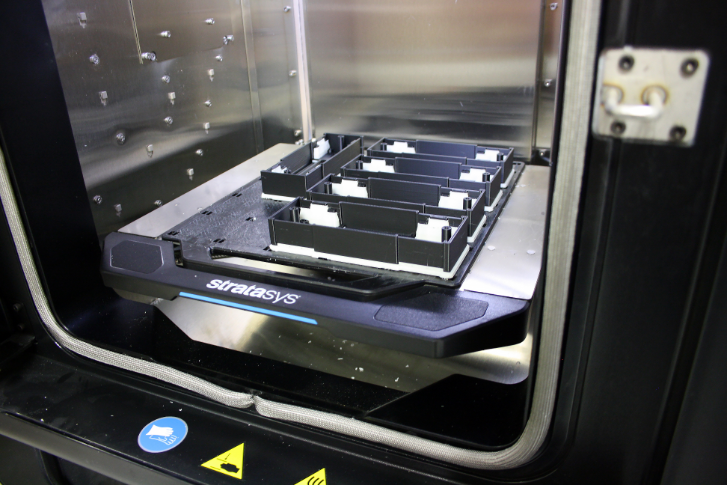 Outer case prototypes that house electronic weighing systems on trolleys, produced with the Stratasys F170 3D printer.
