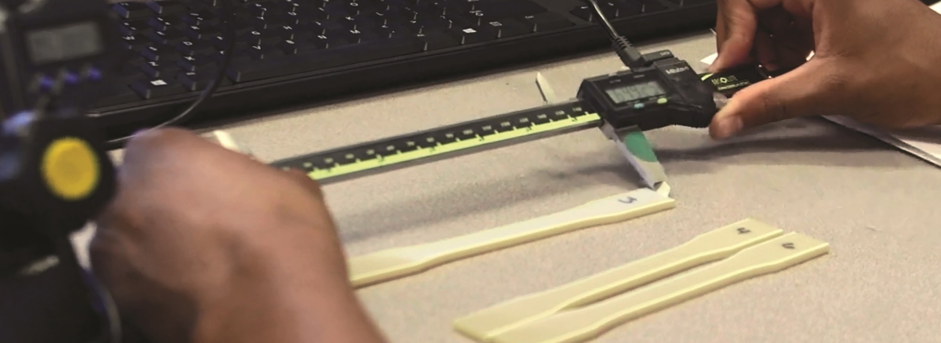 pair of hands working with heat treated FDM material