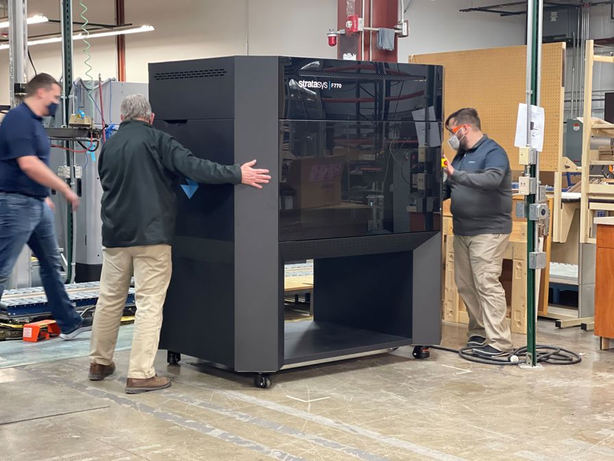 F770 sub zero printer with three men.