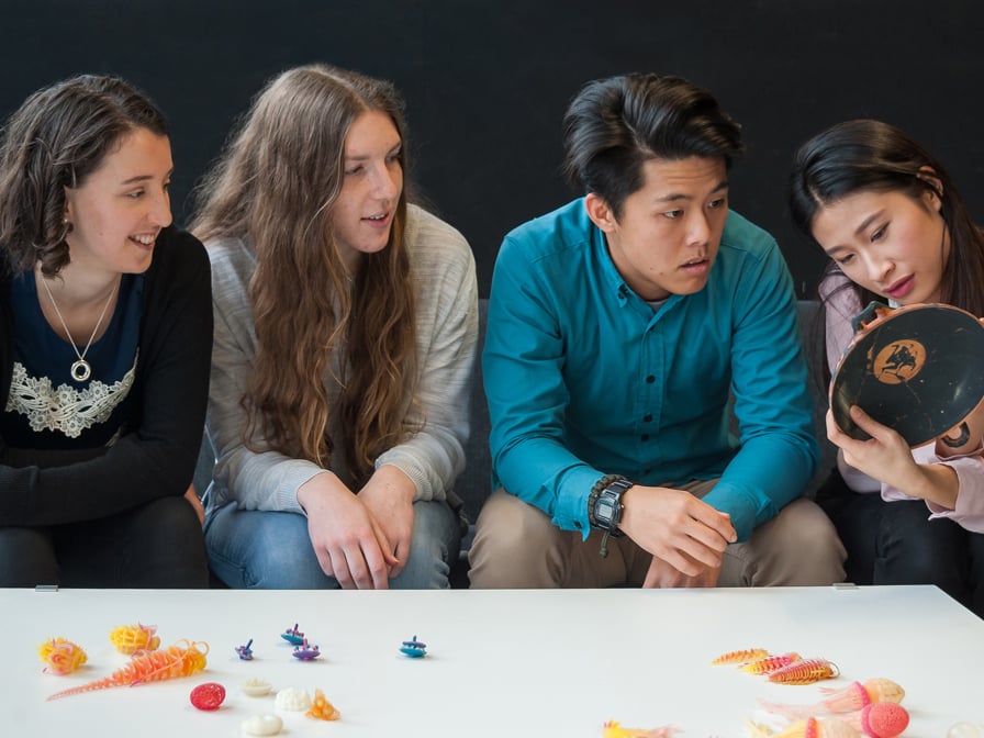 Students look at their 3d printed work.