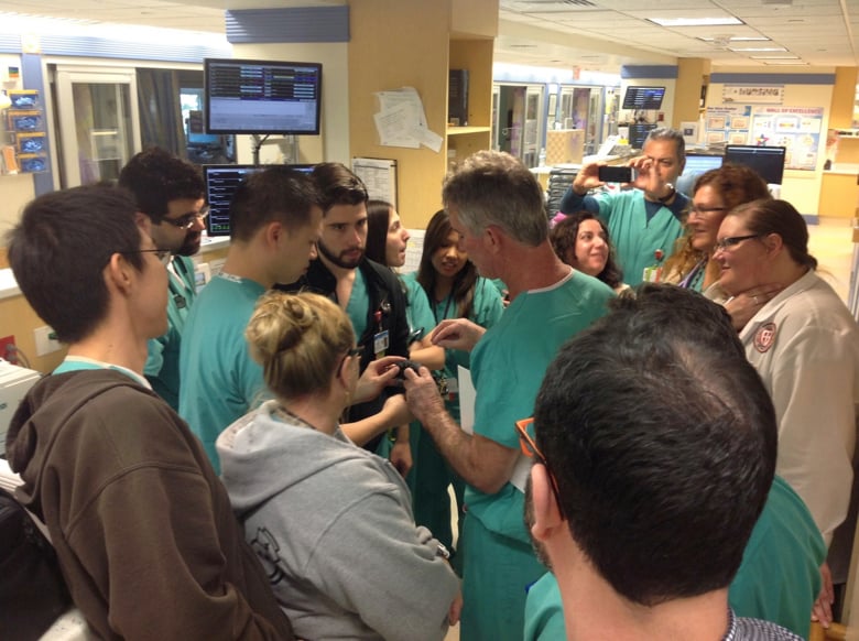 Surgeon in meeting with other doctors