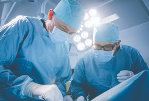 Surgeons working on brain tumor patient. 
