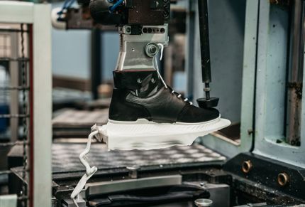 Footwear being manufactured.