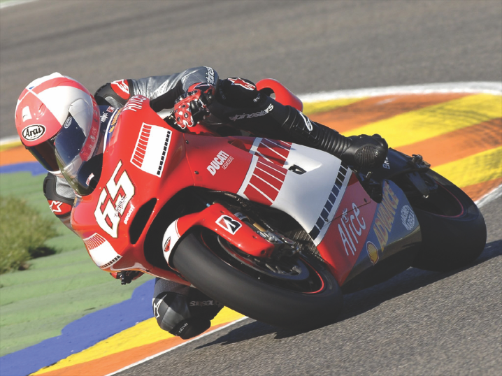 Ducati racing motorcycle cornering.
