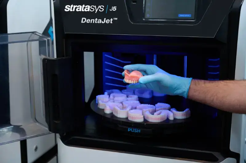 j5 dentajet hand holding truedent denture