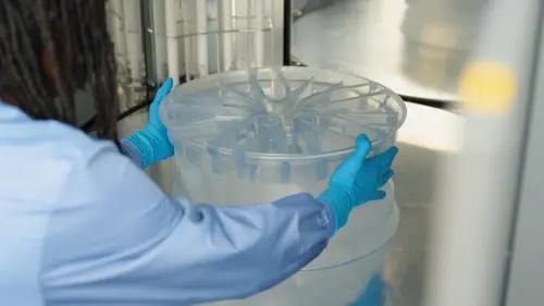 person taking 3d printed rim out of tray