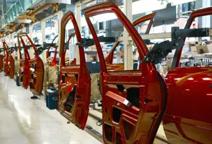 automotive assembly line red car doors