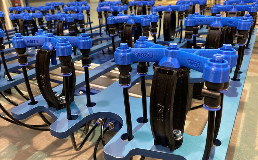 Lightweight Stratasys 3D printed end-of-arm robot tools comprise only two individual parts, resulting in 50% lighter parts and a reduction from fifty minutes to two in refitting the robot.