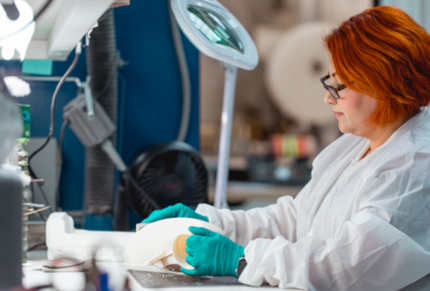 Woman finishing FDM 3d printed part Stratasys Direct